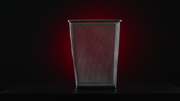 Empty Trash Can On a Red Background
