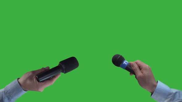 Two reporter holding mic, waiting for interview,green screen background