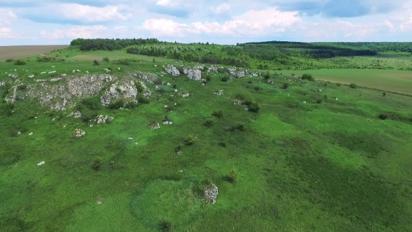 Aerial View Of Green Rocks, Hills, Trees