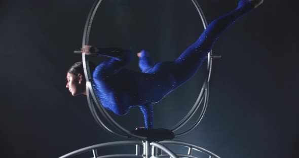 Amazing Aerial Gymnastics Poses in a Hoop Spinning Performance Athlete