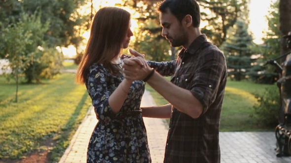 Young Couple Dancing In Park