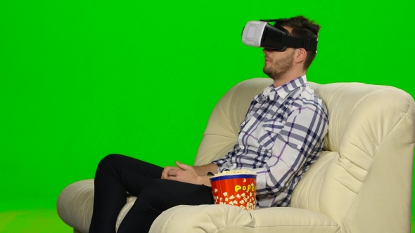 Guy In a Mask Augmented Reality Device. Green Screen