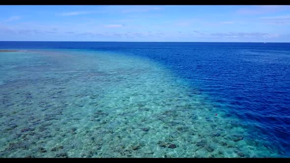 Aerial drone sky of perfect sea view beach trip by blue water with clean sandy background of adventu