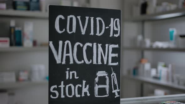A Chalk Plaque with the Inscription About the Presence of a Vaccine for Covid19