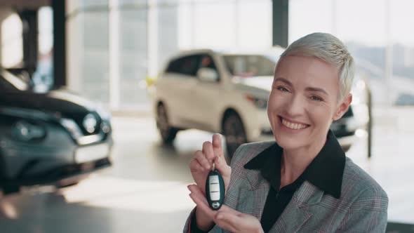 Beautiful Caucasian Female Blond Woman Business Woman Showing Car Keys After