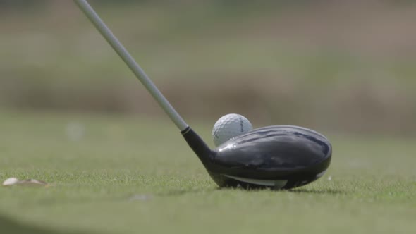 Hitting a golf ball. Close up. Slow motion