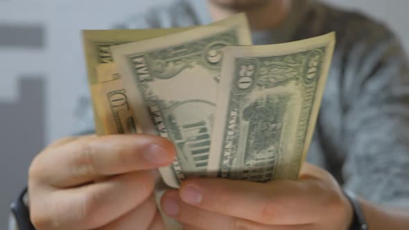 Man Hands Counting Dollars