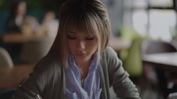 Happiness Attractive Asian Woman Working with Computer Laptop Thinking to Get Ideas and Requirement