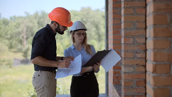 Specialist Builder Construction Architect  Inspecting Renovation Object. Builder Foreman On Jobsite.