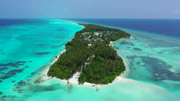 Tropical fly over travel shot of a white sandy paradise beach and aqua turquoise water background