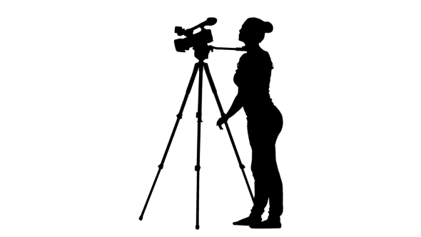 Girl Conducting Shooting. The Camera On Tripod. Silhouette. White