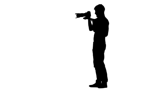 Man Makes Videotaping, Turning Around Itself. Silhouette. White Background