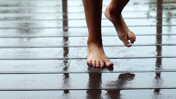 Girl Dancing Barefeet in The Rain