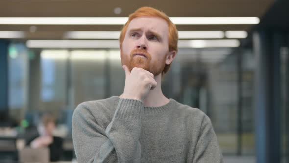 Portrait of Pensive Young Man Thinking