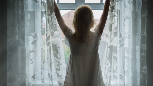 Beautiful Young Woman Opening Curtains in Morning Time 1