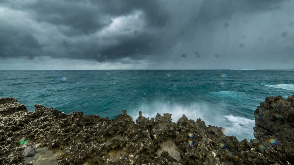 Storm In Ocean With Storm Clouds, Waves Breaking On The Rocky Coast. 