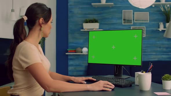 Caucasian Female at Her Desk Working on Personal Computer