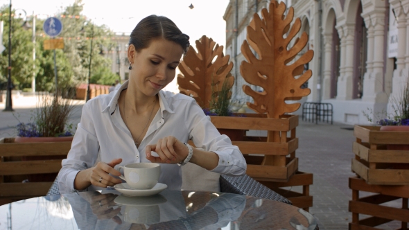 Portrait of a Young Beautiful Businesswomen Enjoying Coffee alt