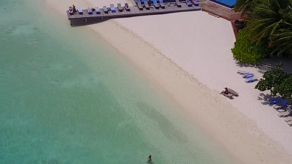 Aerial view panorama of seashore beach by blue ocean and sand background