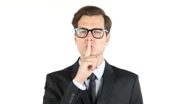 Silence Gesture by  Businessman in Glasses