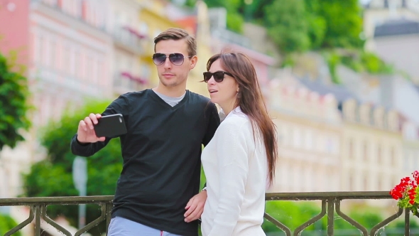 Selfie Photo By Caucasian Couple Traveling In Europe. Romantic Travel Woman And Man In Love Smiling