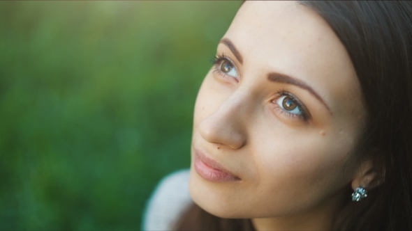 Young Woman Looking Forward At The Sky