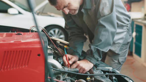 Professional Car Mechanic Working in Auto Repair Service
