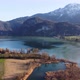 Aerial view of the lake Kochel with the penstocks of a pumped-storage plant in the background - VideoHive Item for Sale