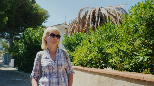 Woman Tourist Walking On The Seaside Resort