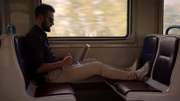 Mobile Worker Typing On Laptop In Train. Freelancer Internet Online Meeting Webinar. Study Online.