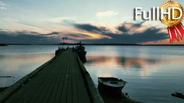 Tranquil Sunrise on Lake With Wooden Pier