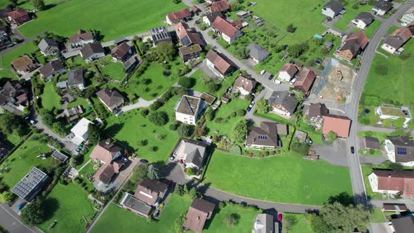 Aerial View of Liechtenstein with Houses on Green Fields in Alps Mountain Valley