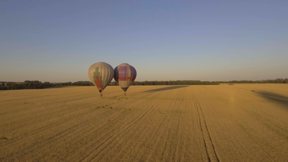 Hot Air Balloons In The Sky Over a field.Aerial View alt