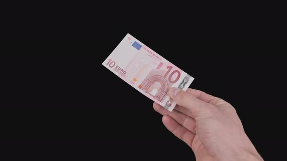 Male Hand Shows a Banknote of 10 Euro with Alpha Channel