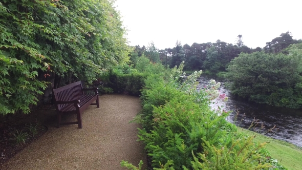 View From Deck With Bench To River In Ireland 7