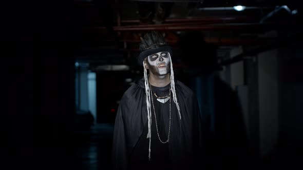 Scary Guy in Carnival Costume of Halloween Skeleton Making Angry Faces, Trying To Scare on Parking