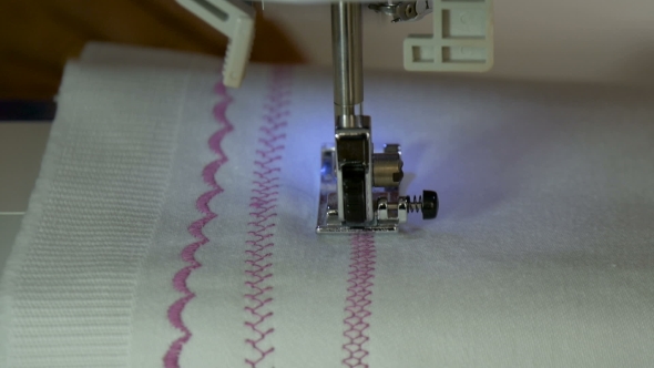 A Sewing Machine, Sew The Fabric