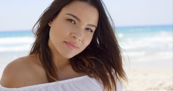 Gorgeous Young Woman Relaxing On The Beach