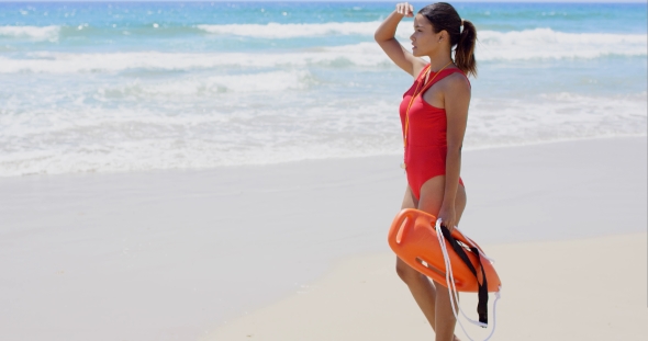 Side View On Woman In Red With Buoy