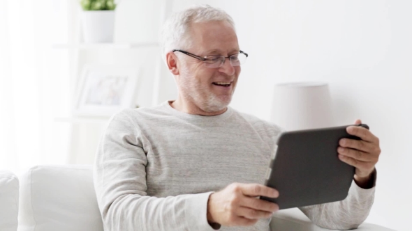 Senior Man With Video Call On Tablet Pc At Home 87