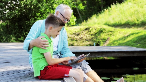 Grandfather And Boy With Tablet Pc  In Country 35