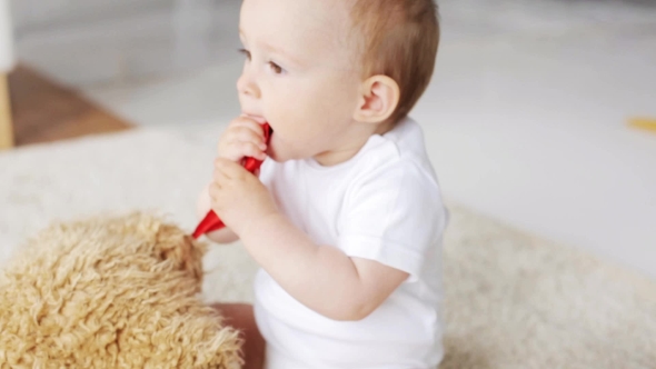 Little Baby Playing With Teddy Bear At Home 27