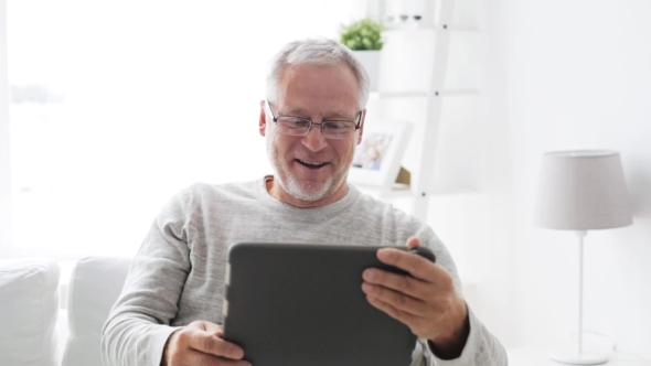 Senior Man With Video Call On Tablet Pc At Home 12