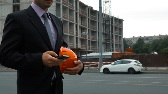 Attractive Construction Engineer Answering Call.