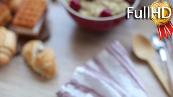 Breakfast of Porridge With Cherries and Pastry