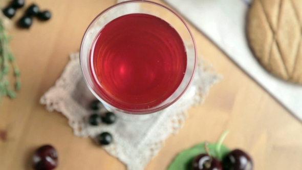 Crystal Glass With a Fruit Drink. Beautiful Table Setting.