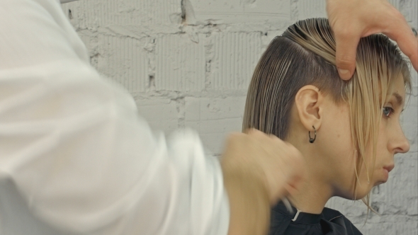 Hairdresser Girl Combing Her Hair