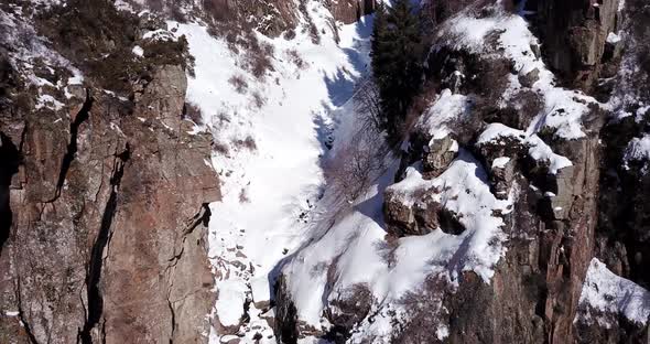 Freezing Waterfall in the Snowy Mountains