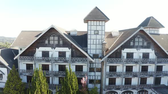 Rise up shot of the mont blanc abandoned luxury hotel in campos de jordao brasil, America, drone sho