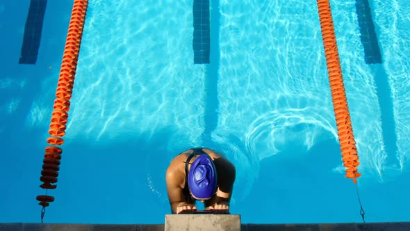 High angle view of female swimmer swimming inside pool 4k